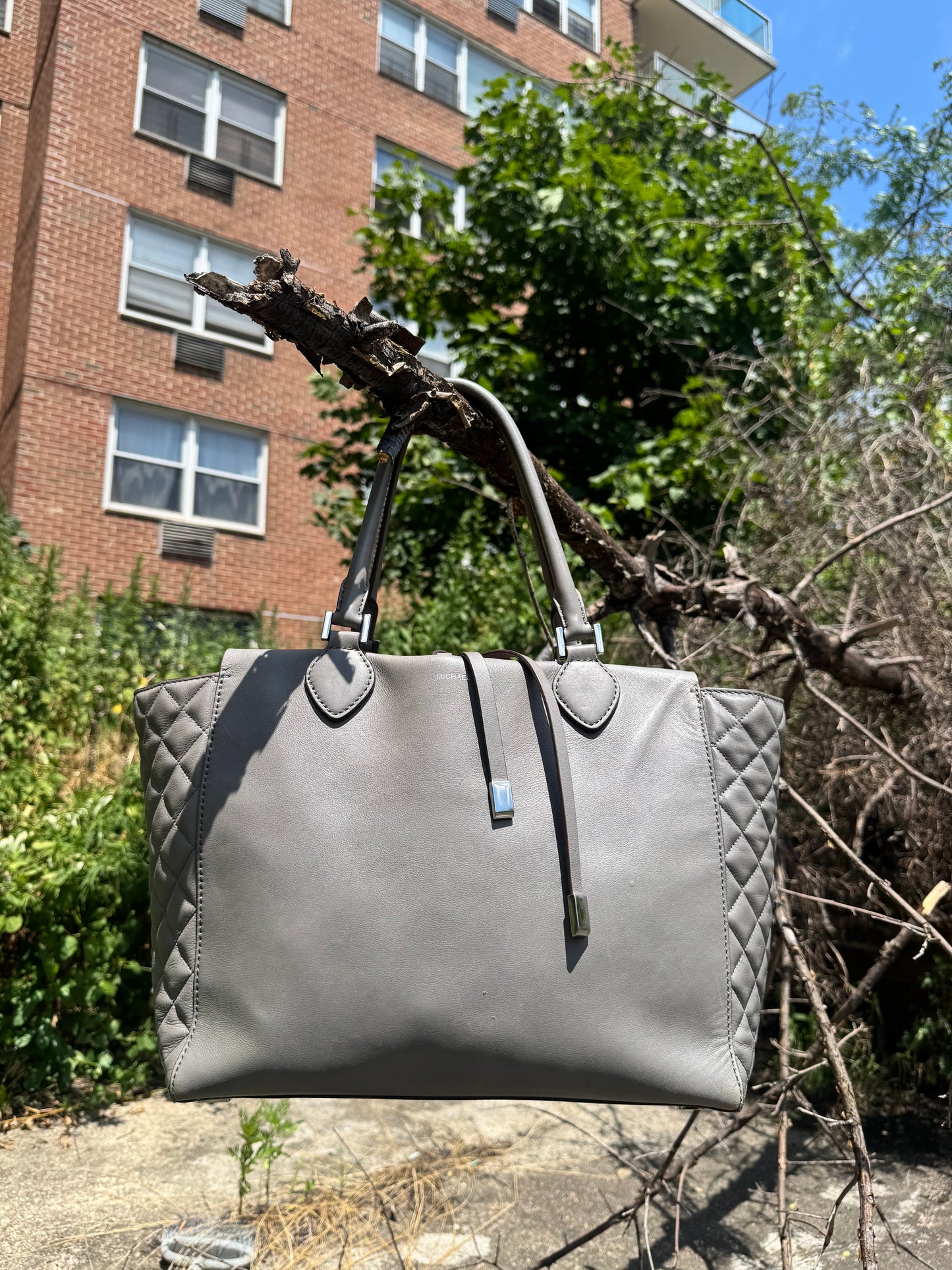 #85. Michael Kors “Miranda” Gray Quilted Bag