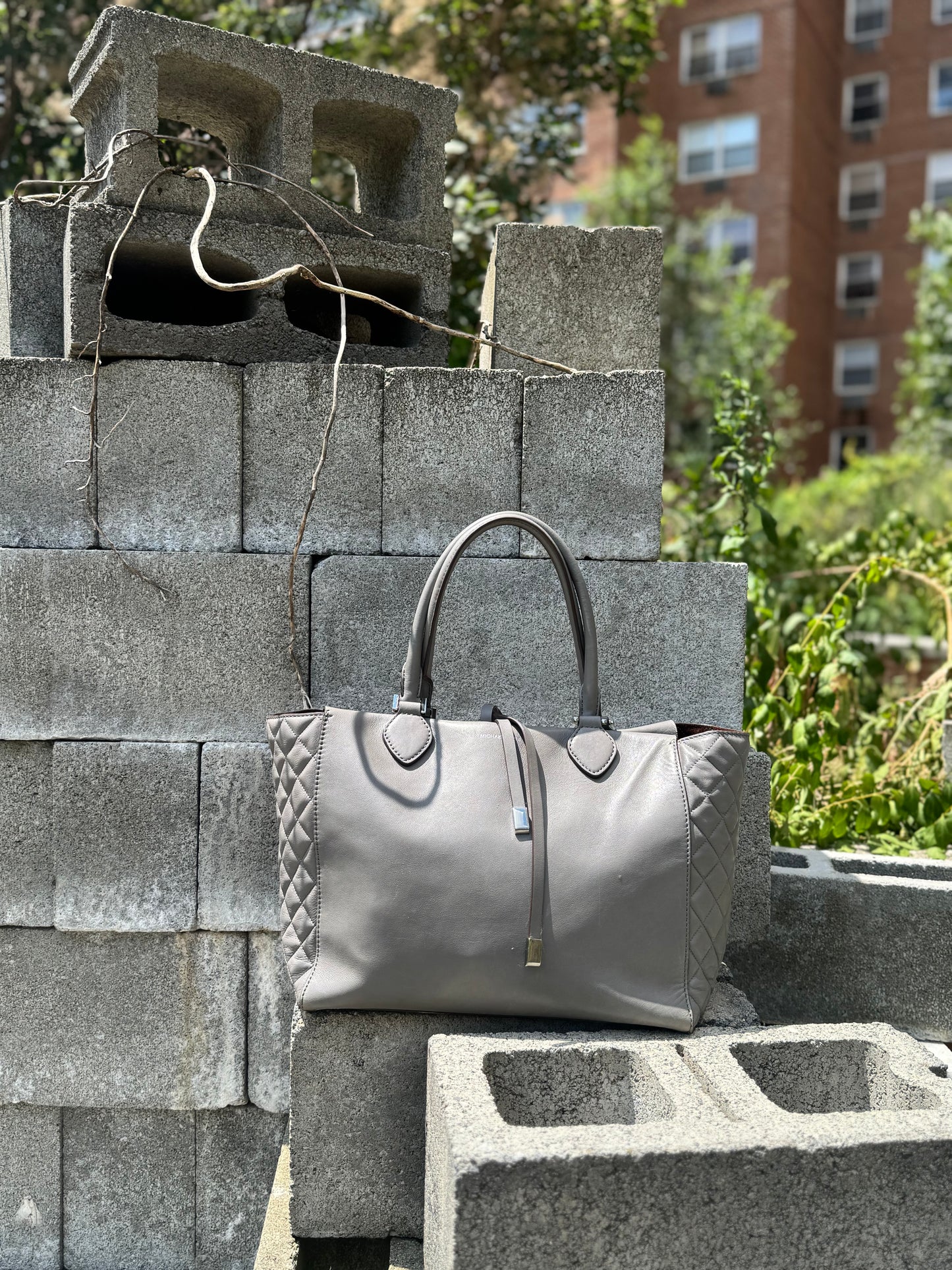 #85. Michael Kors “Miranda” Gray Quilted Bag