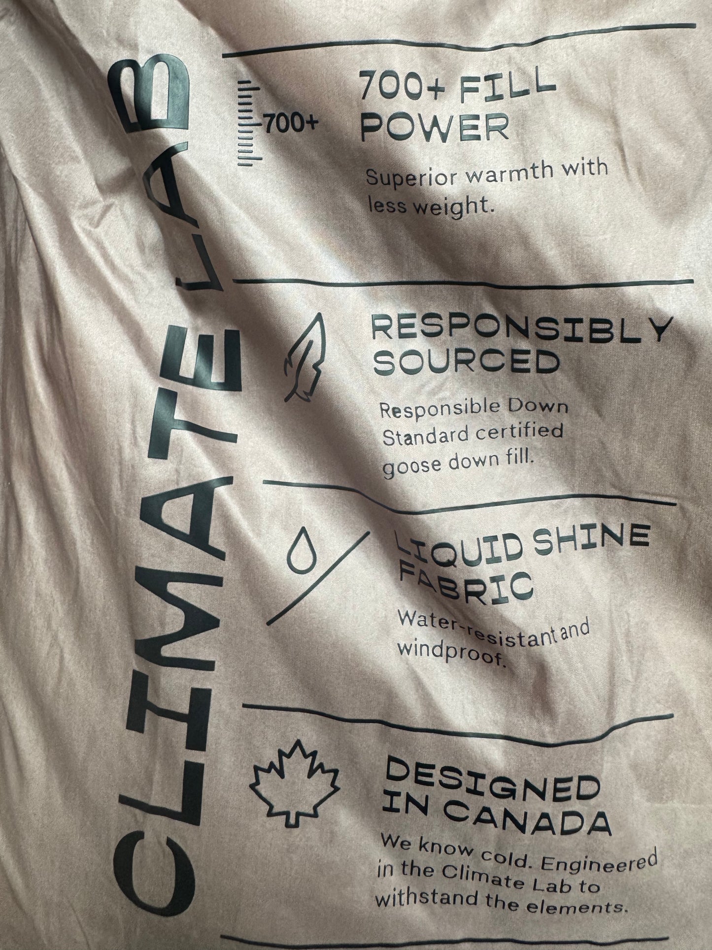 Trend: Liquid Shine 700+ Fill “Super Puff” Coat in Iridescent Pink