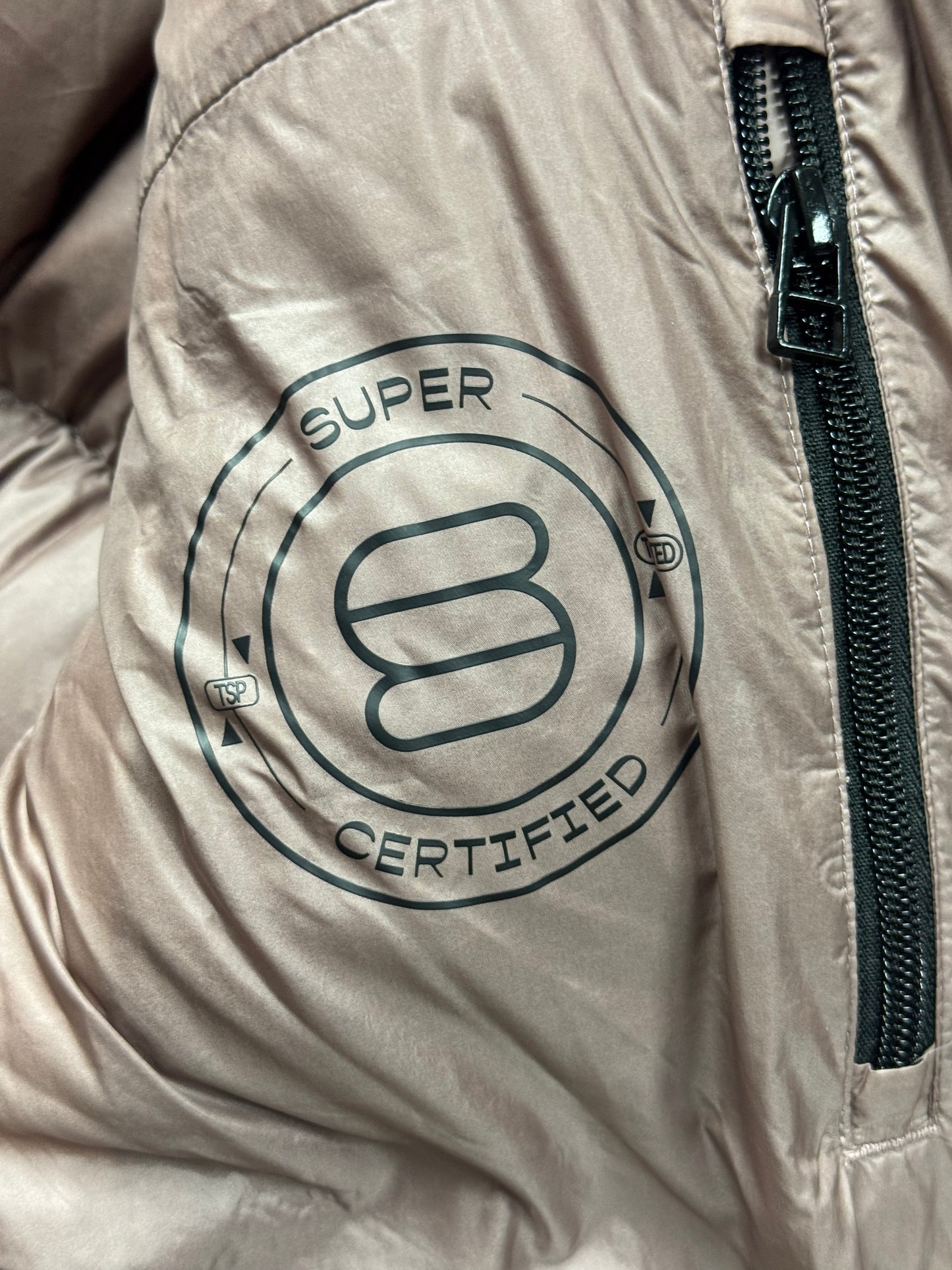 Trend: Liquid Shine 700+ Fill “Super Puff” Coat in Iridescent Pink